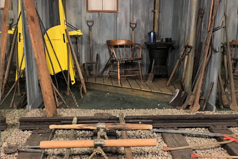 Old railroad workshop with handcar and tools