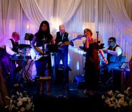 Live band performing on decorated stage