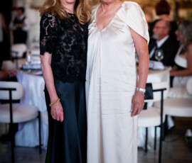 Two women in elegant evening gowns